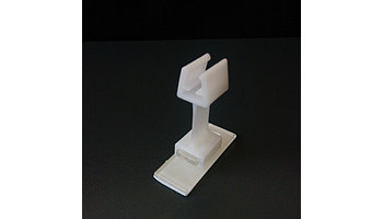 Flexible clip with adhesive